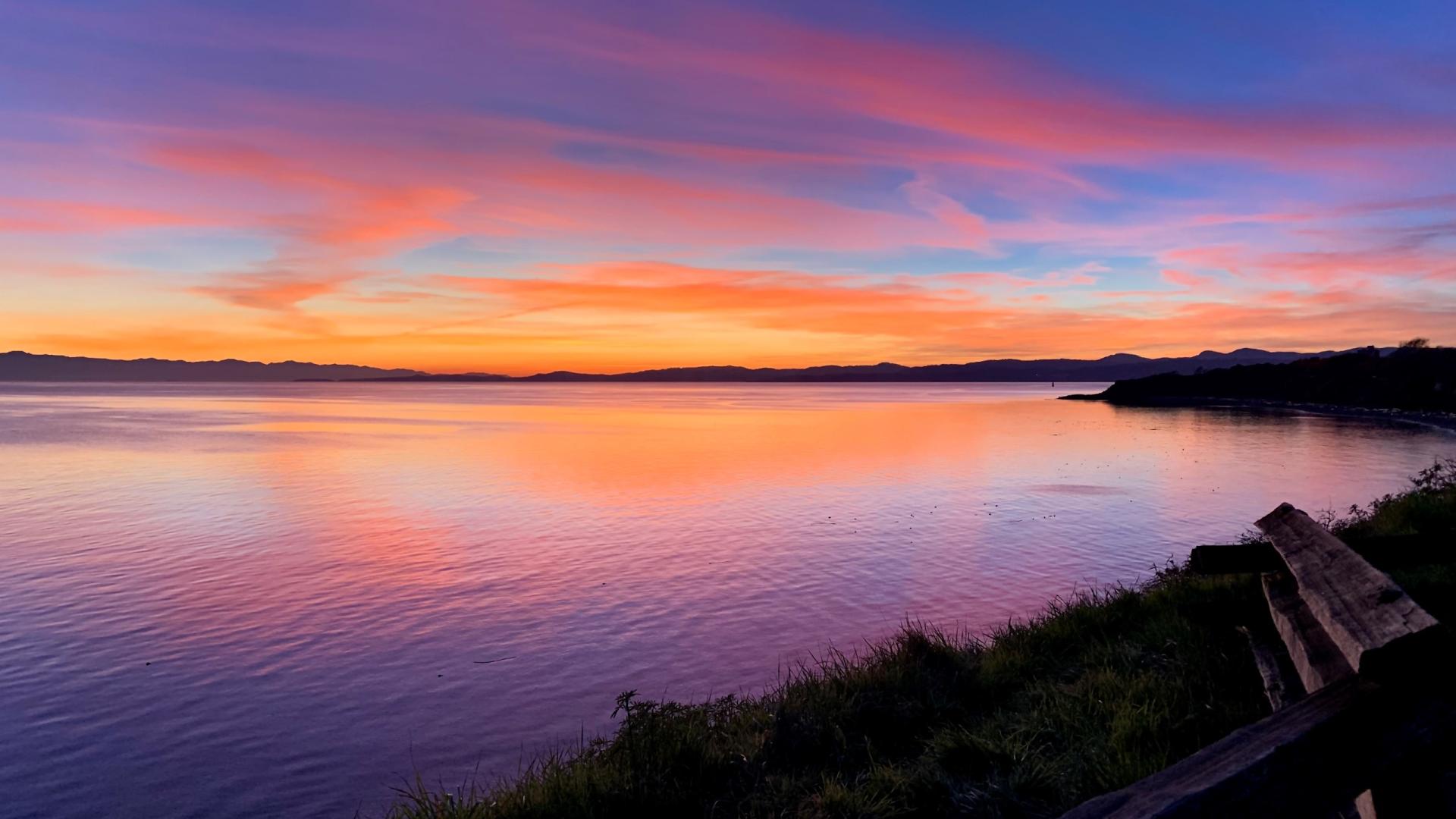 An image of a sunset over the water along Dallas Road