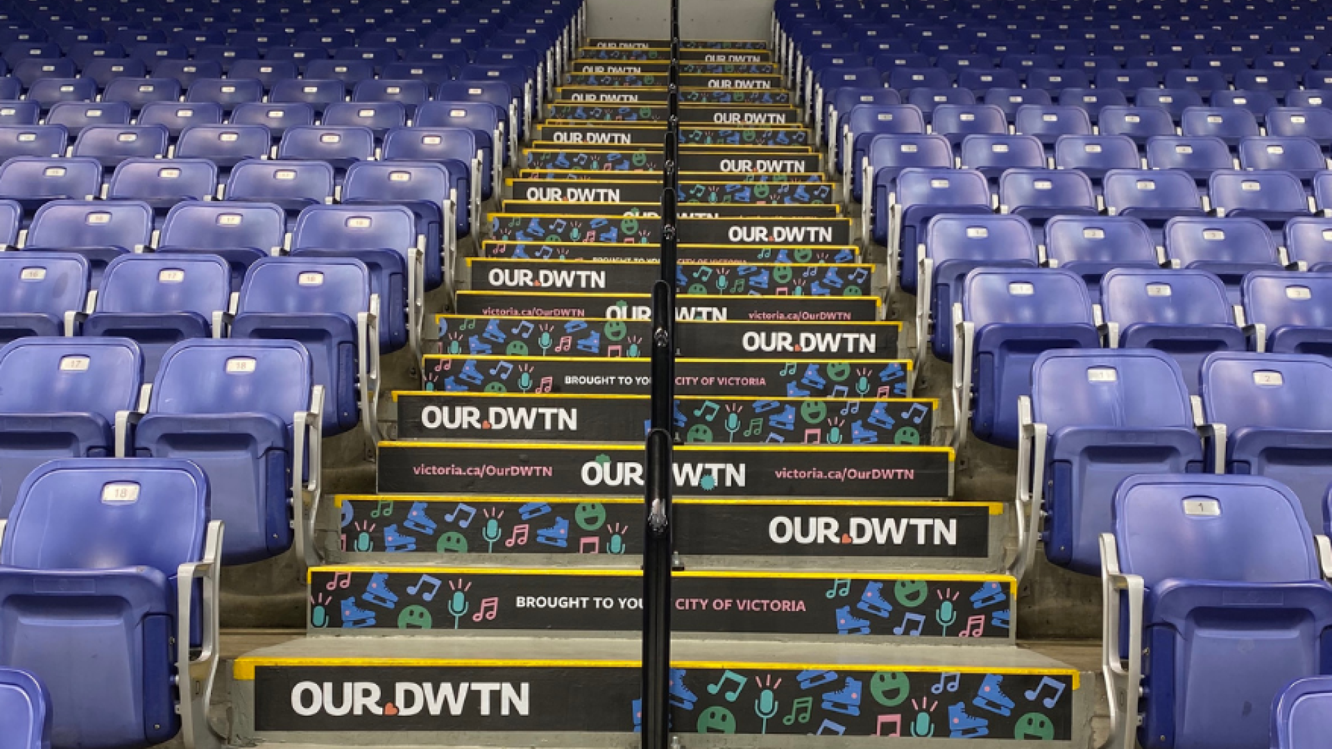 OUR DWTN branding on set of stairs inside the Save-On Foods Memorial Centre