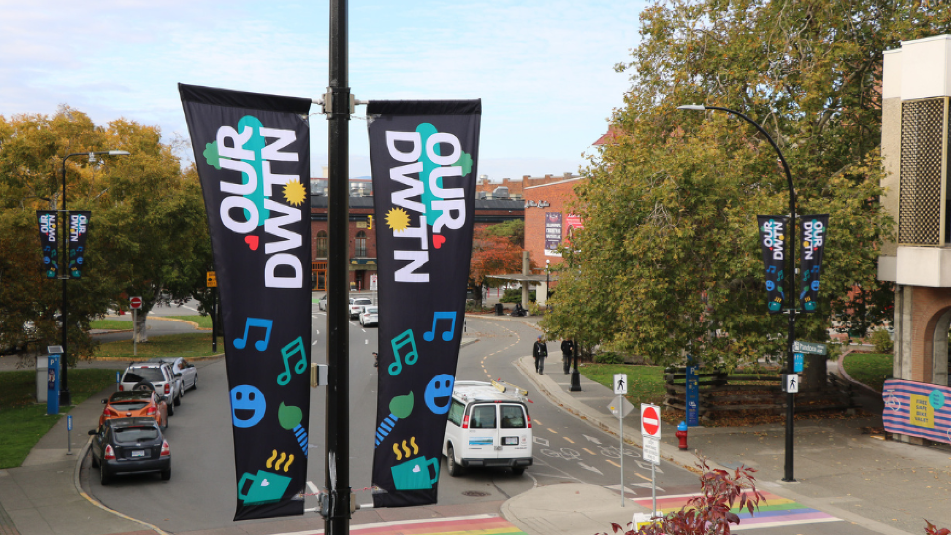 Image of the City's decorative OUR DWTN banners installed on a downtown lamppost on Pandora Avenue.