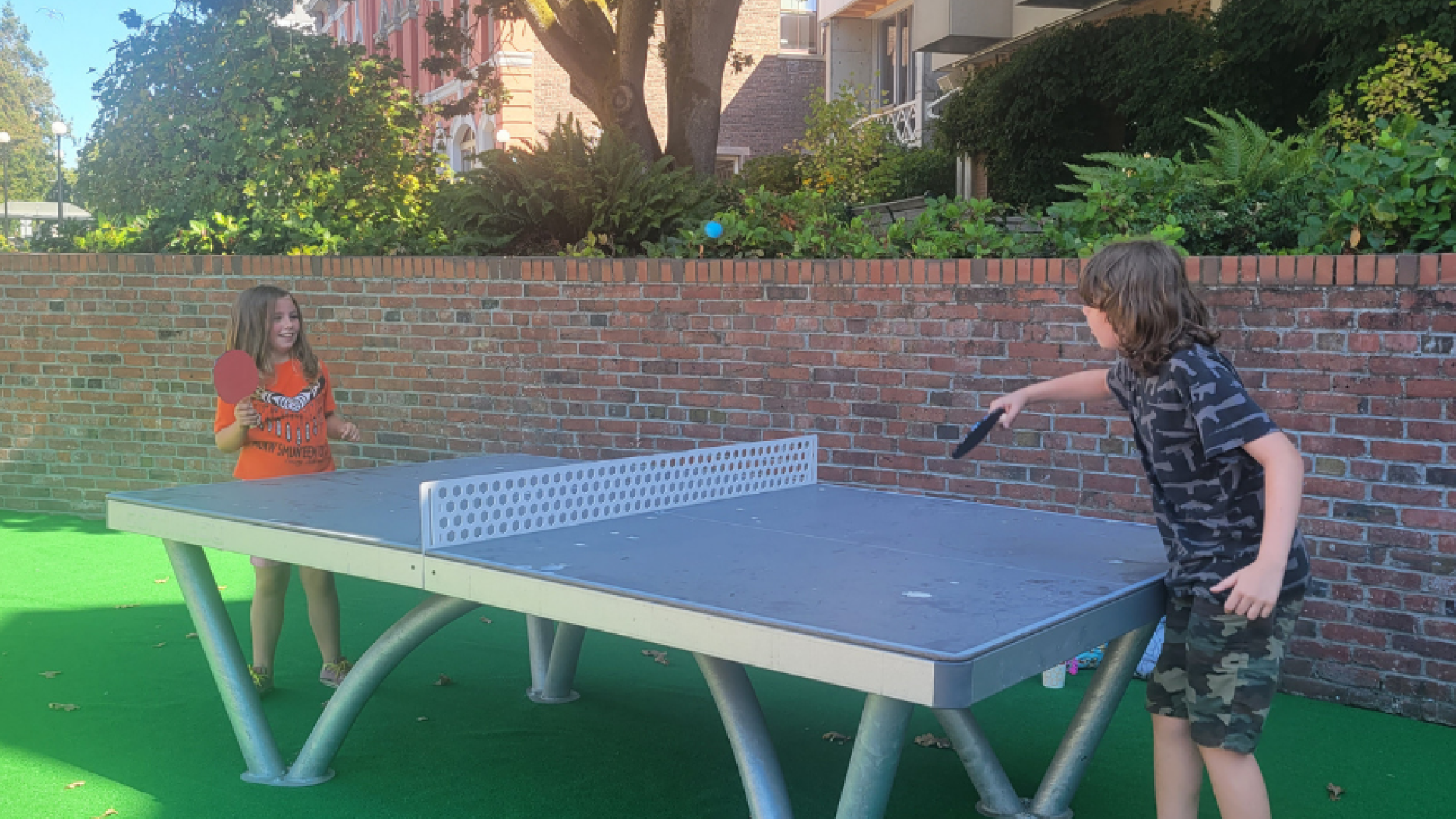 Image of two children playing ping pong at pop-up in Centennial Square